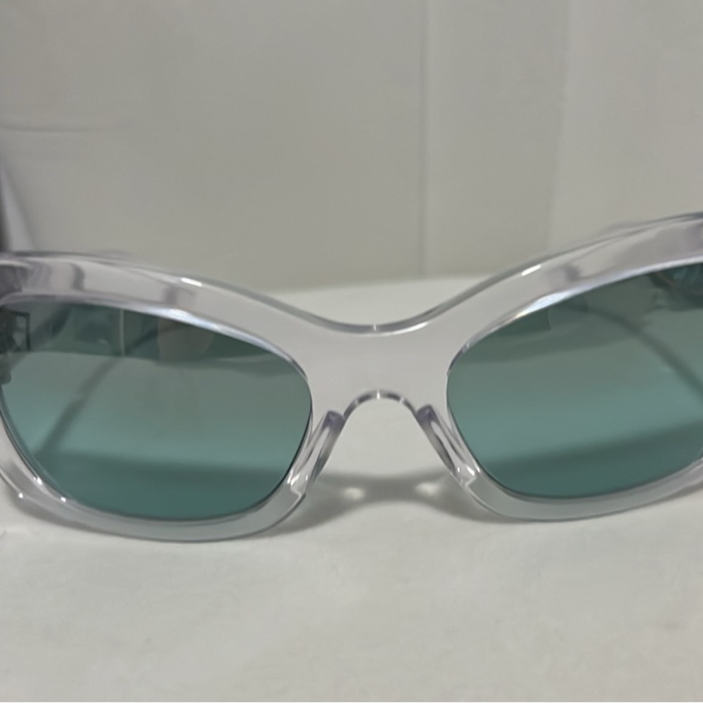 Prada Clear Frame Sunglasses with Teal Lenses